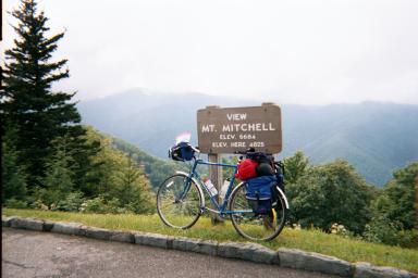 A woman mountain biking; Actual size=180 pixels wide